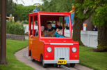 Family with young children in Postman Pat's van in CBeebies Land Alton Towers