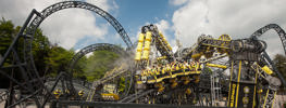 Group of people sat on The Smiler Rollercoaster at Alton Towers going down the track