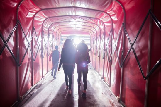Group walking through players tunnel on the Arsenal stadium tour
