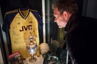 Man looking at exhibit in the Arsenal stadium museum