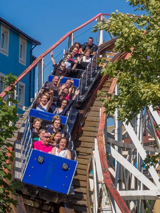 people riding the big dipper rollercoaster at Blackpool pleasure beach