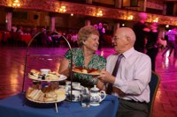 Elderly couple enjoying afternoon tea at Blackpool Tower Ballroom 