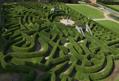 Aerial view of mazes at Blenheim Palace on a sunny day, lighting up the hedges