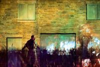 Light projections on brick wall with display at Bodmin Jail