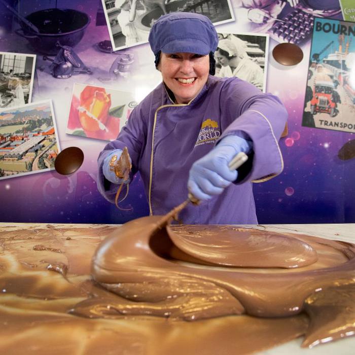 Chocolatier mixing chocolate at Cadbury World