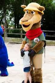 Swampy the Ogre mascot meeting child at Camel Creek