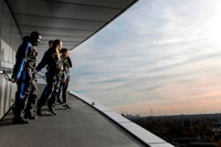 People stood admiring view at sunset at The Dare Skywalk