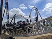 Sik rollercoaster travelling round track at Flamingo Land