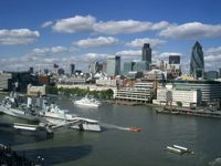 View of London skyline with HMS Belfast on River Thames