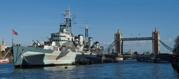 head-on angle of HMS Belfast with Tower Bridge directly behind