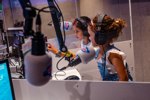 Children enjoying acting as Radio DJ's at KidZania London