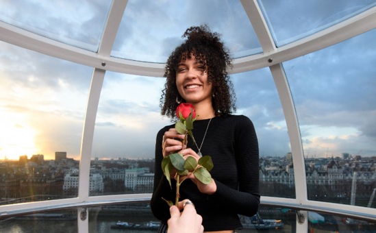 Woman enjoying the London Eye Cupid's Pod