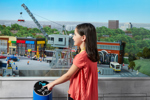 Young girl interacting with landmark at Miniland at Legoland Discovery Centre Manchester