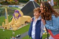 Child and Parent next to mini Egypt in Miniland at Legoland Resort Windsor