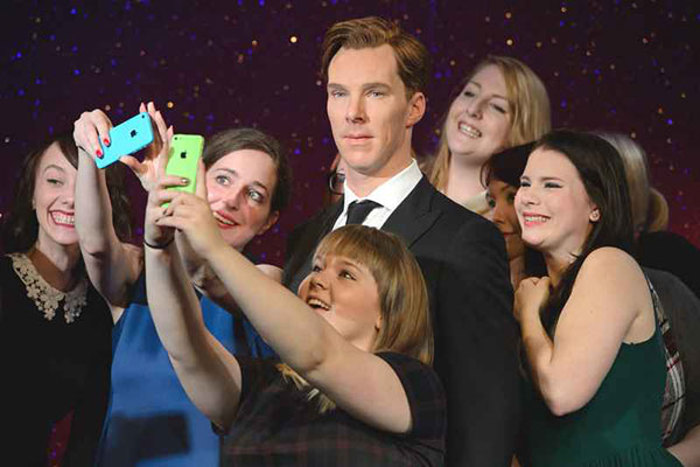 Madame Tussauds London group of people taking picture with Benedict Cumberbatch wax work