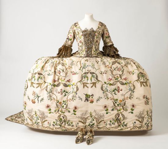 Regency era dress with patterned fabric and detailed corset