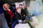 Young child and parents enjoy Penguin Ice Adventure at Sea Life Birmingham