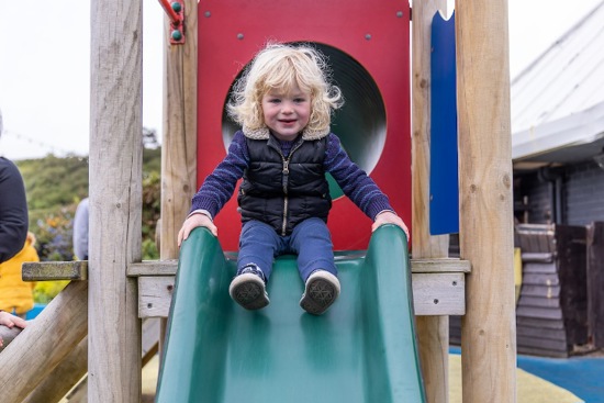 Child enjoying slide at SEA LIFE Scarborough playground