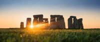 Sun setting behind Stonehenge