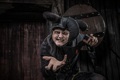 Jester actor leaning towards camera at Blackpool Dungeon