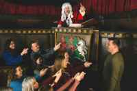 Group entertained by London Dungeon courtroom