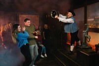 Group enjoying Great Fire of London show at London Dungeon