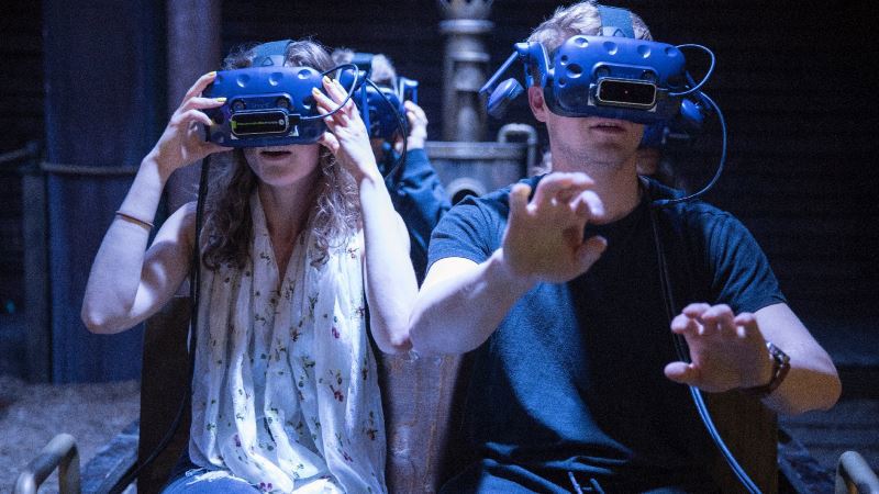 two guests at the war of the worlds experience wearing VR headsets experiencing the performance