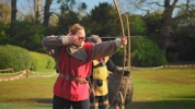 Instructor teaching archery at Warwick Castle