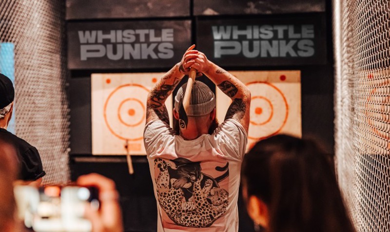 Person throwing axe at Whistle Punks Urban Axe Throwing Manchester